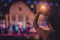 Sister making heart shape hands for performers on stage Royalty Free Stock Photo