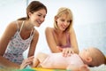 Sister visiting a young mother with her newborn infant in hospital Royalty Free Stock Photo