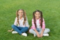 Sisterhood and friendship. We are friends. Cheerful schoolgirls on sunny day. Girl ponytails hairstyle enjoy relax