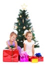 Sisters at Christmas tree Royalty Free Stock Photo