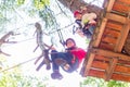 Sisters climbing in high rope course together Royalty Free Stock Photo
