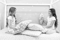 Sisters communication. Children relax and having fun in evening. Sisters leisure. Girls in cute pajamas spend time Royalty Free Stock Photo