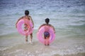 Sisters with float tubes Royalty Free Stock Photo