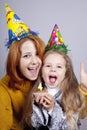 Sisters four and eighteen years old at birthday. Royalty Free Stock Photo