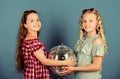 Sisters friends with disco ball. Lets start party. Cheerful kids hold disco ball. Disco dances. Retro music. Mirrors