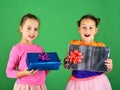 Sisters with gift boxes for holiday. Children with happy faces