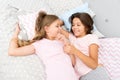 Sisters happy small kids relaxing in bedroom. Friendship of small girls. Leisure and fun. Having fun with best friend