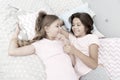Sisters happy small kids relaxing in bedroom. Friendship of small girls. Leisure and fun. Having fun with best friend Royalty Free Stock Photo