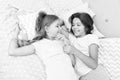 Sisters happy small kids relaxing in bedroom. Friendship of small girls. Leisure and fun. Having fun with best friend Royalty Free Stock Photo