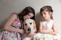 Sisters with her dog Royalty Free Stock Photo