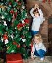 Sisters at home with Christmas tree