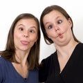 Sisters looking silly with puckered lips