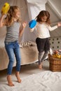 Sisters make the best friends. Shot of two cute little girls playing with tambourines at home. Royalty Free Stock Photo