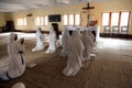 Sisters of Mother Teresa`s Missionaries of Charity in prayer in the chapel of the Mother House, Kolkata Royalty Free Stock Photo