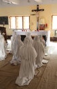 Sisters of Mother Teresa`s Missionaries of Charity in prayer in the chapel of the Mother House, Kolkata Royalty Free Stock Photo