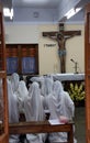 Sisters of Mother Teresa`s Missionaries of Charity in prayer in the chapel of the Mother House, Kolkata Royalty Free Stock Photo