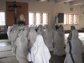 Sisters of Mother Teresa`s Missionaries of Charity in prayer in the chapel of the Mother House, Kolkata Royalty Free Stock Photo