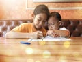 Sisters painting in living room Royalty Free Stock Photo