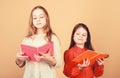 Sisters pick books to read together. Adorable girls love books. Secret diary. Opening doors through literacy. Kids girls