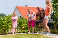 Sisters playing bocce in garden front or their home Royalty Free Stock Photo