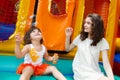 Sisters playing with bubble wand Royalty Free Stock Photo