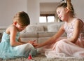 Sisters polish nails to etch other. Royalty Free Stock Photo