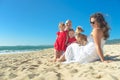 Family with kids and dog on the beach Royalty Free Stock Photo