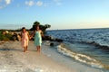 Sisters running at the beach Royalty Free Stock Photo