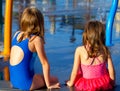 Sisters Sit at a Splash Pad