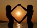 Sisters take with hands on sunset Royalty Free Stock Photo