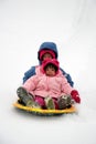 Sisters tobogganing Royalty Free Stock Photo