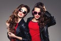 Sisters twins in hipster sun glasses laughing Two fashion models Royalty Free Stock Photo