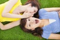 Sisters whispering on the meadow and surprised expression Royalty Free Stock Photo