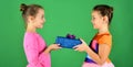 Sisters with wrapped gift boxes share presents for holiday