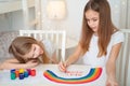 Sisters write stay at home. flashmob. rainbow. Royalty Free Stock Photo