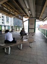 Sit and waiting at skytrain station.