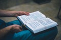 Sited man studying the torah on hes knees unrecognizable Royalty Free Stock Photo