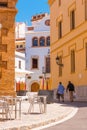 SITGES, CATALUNYA, SPAIN - JUNE 20, 2017: Two men walk through the historic part of the city. Copy space for text. Vertical. Royalty Free Stock Photo