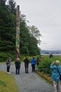 Sitka, Alaska, USA: A guide tells visitors about the history and symbolism of Tsinglit totems