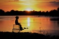 A sits on the river and catches fish. A photo of the silhouette under the sun Royalty Free Stock Photo