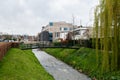 Sittard, Limburg, The Netherlands - The Keutel creek at the suburbs of the city with contemporary apartmetn blocks in the