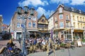 View on market suqare with exterior busy street cafes, traditional colorful houses, blue sunny sky Royalty Free Stock Photo