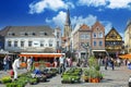 Sittard, Netherlands - March 25. 2022: View on traditional local farmer market square in ancient town, colorful old buildings on s