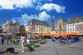 Sittard, Netherlands - March 25. 2022: View on traditional local farmer market square in ancient town, colorful old buildings on s