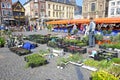 Sittard, Netherlands - March 25. 2022: View on traditional local farmer market square in ancient town, colorful old buildings on s