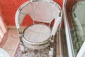 A sitting area on the balcony with a rattan wicker chair, a rug. Top view Royalty Free Stock Photo