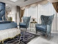 A sitting area in the bedroom with two comfortable designer blue armchairs with a gold pattern and a gilded table with a vase of