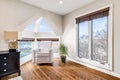 Sitting area in a large bedroom in a city condo.