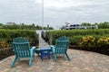 Sitting area on paved walkway to dock