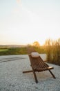 Sitting Area Beside a Wine Country Home, Shaded Wooden Lounge Chairs sit beside a relaxing Hammock Swing Royalty Free Stock Photo